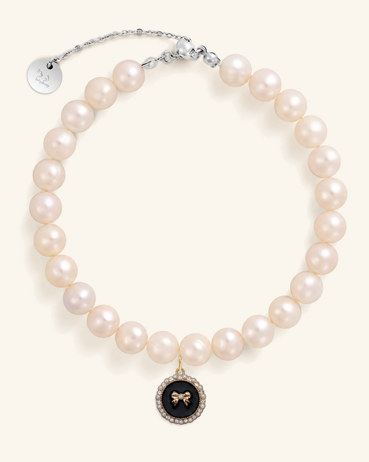 Freshwater pearl necklace for cats with a black bow charm and silver clasp