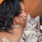 Woman and her tabby kitten wearing matching freshwater pearl necklaces