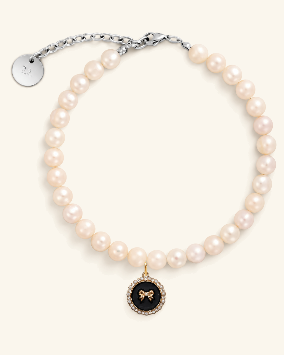 Freshwater pearl necklace for dogs with a black bow charm and silver clasp