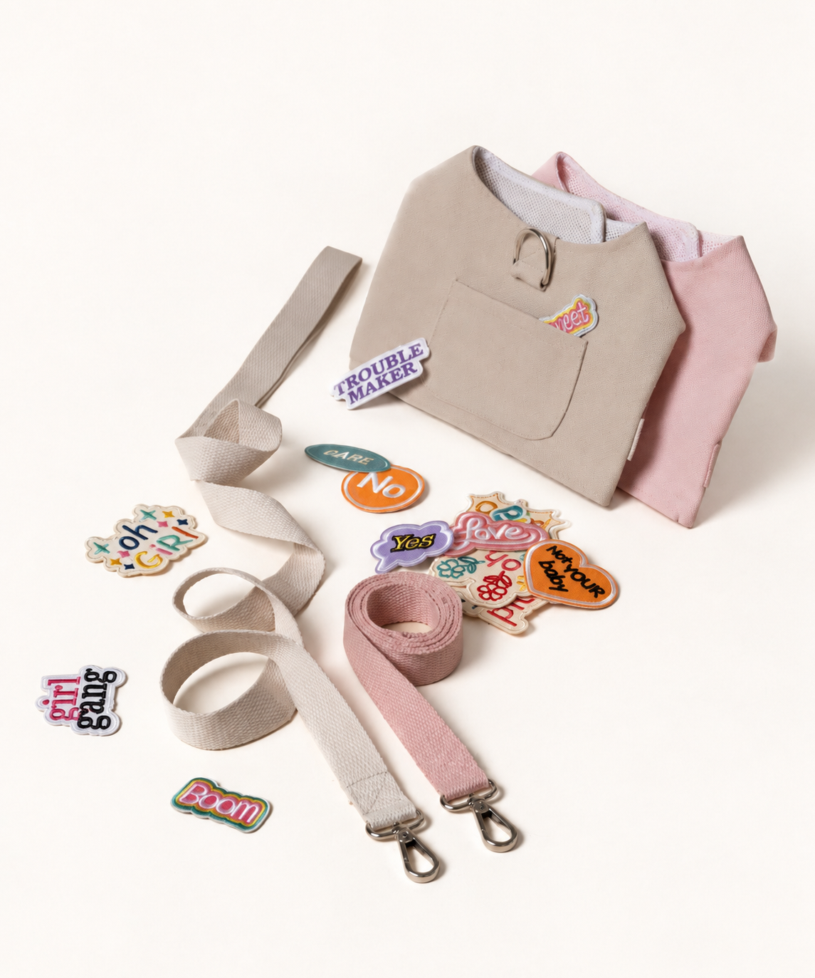 Beige and pink harness sets with leashes and patches